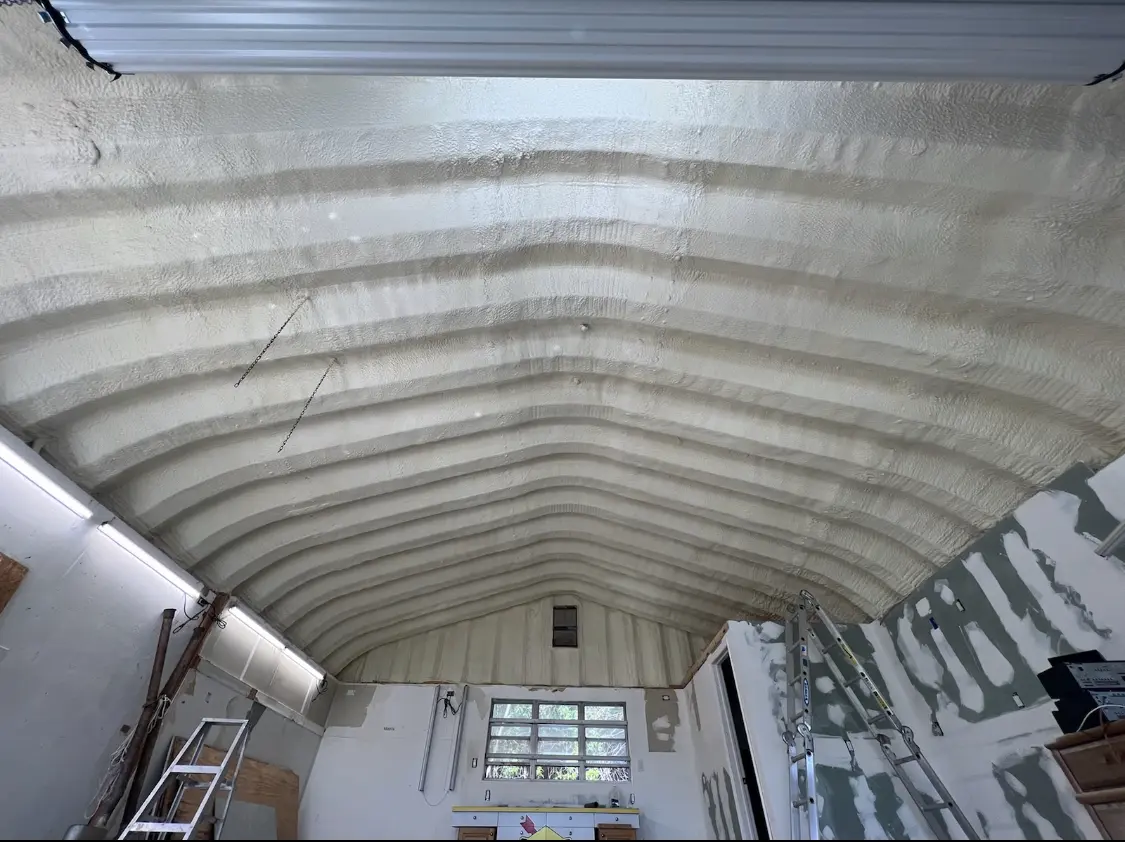 Spray polyurethane foam applied to the underside of a metal roof deck in Spring Valley